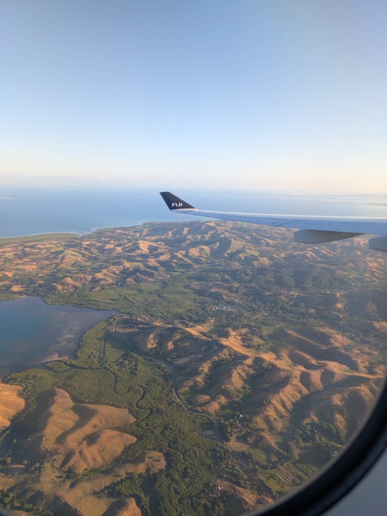 A bird's-eye-view of the beautiful coast and rolling hills of Nadi, Fiji.
